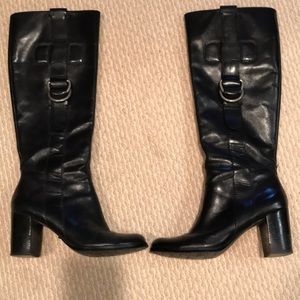 Black, leather, tall boots with a 2 inch high heel
